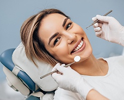 Closeup of patient smiling while relaxing in treatment chair