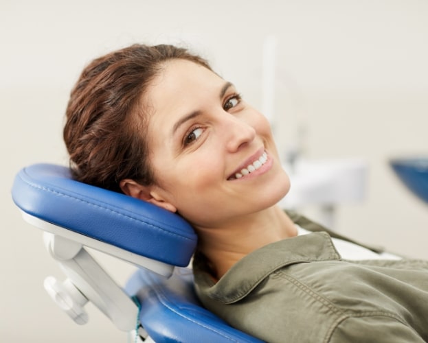 Dental patient smiling dental chair