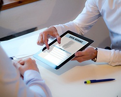 Dentist reviewing dental insurance information with patient