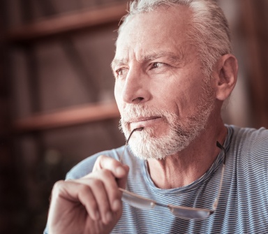 Frowing man in need of emergency dentistry