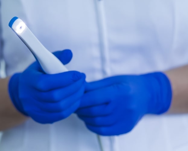 Dentist holding intraoral camera