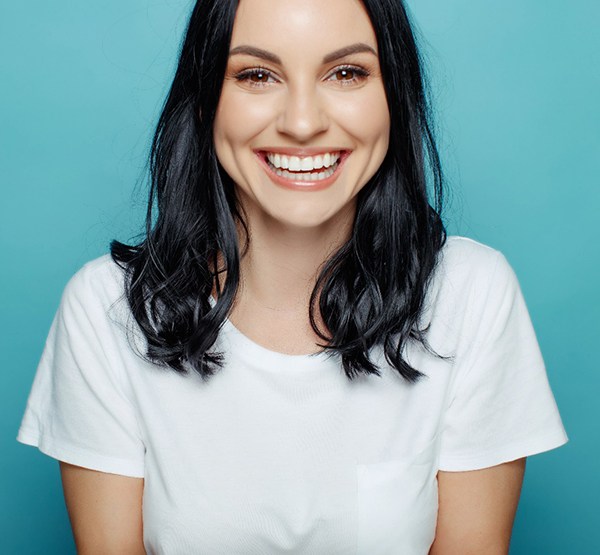 Woman smiling after teeth whitening in Dudley