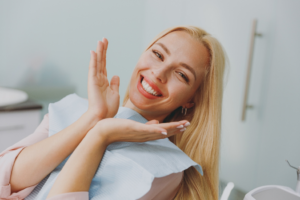a patient smiling after receiving teeth whitening