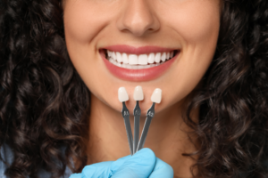 a patient admiring their veneers